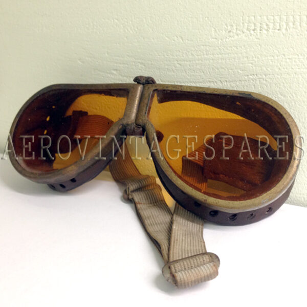 A pair of Royal Flying Corps WW1 leather flying goggles that came from the estate of a 1st WW RFC pilot with many other items.  With elasticated strap and orange tinted glass.  Worn but in very good condition for age.  The elastic has lost some of its elasticity, but perfect for display.